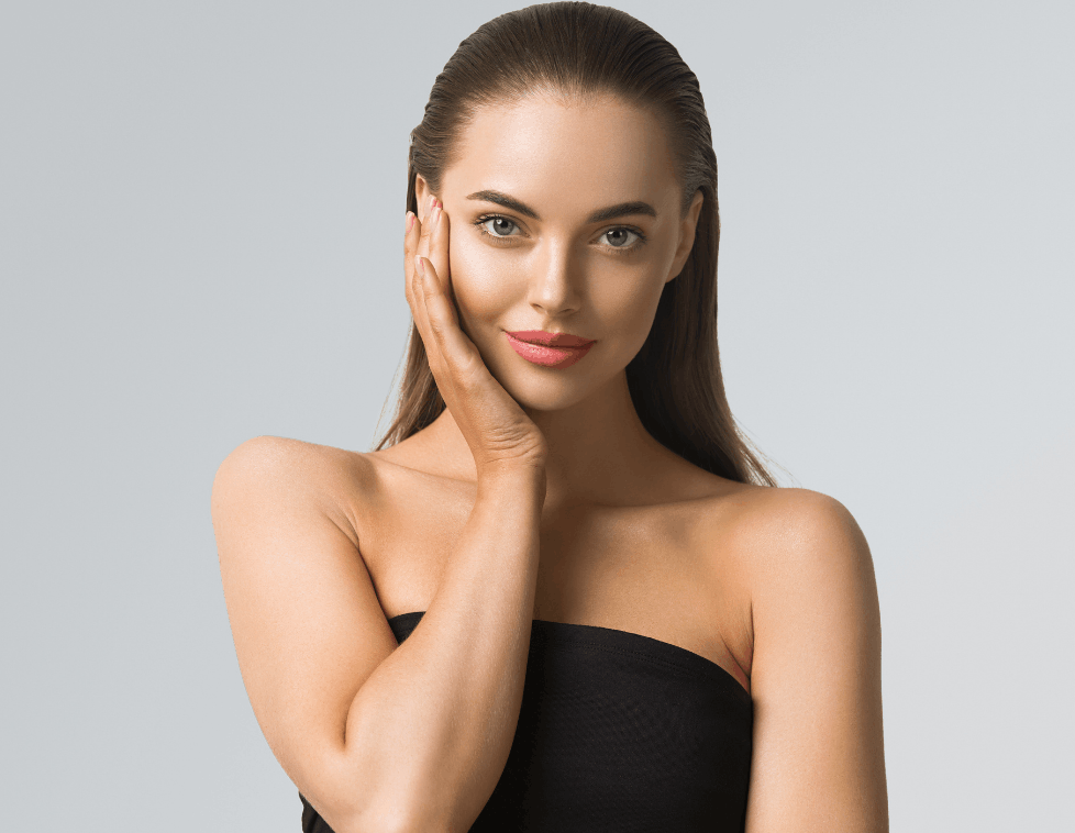 Portrait of a confident woman with smooth skin and natural makeup.